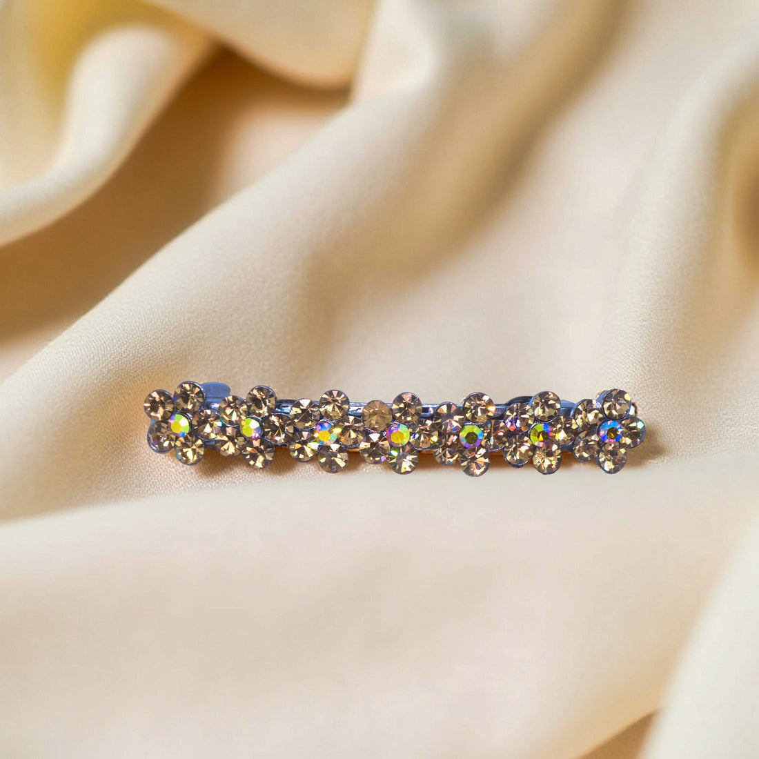 Haerime FloraDot Row Barrette in Amber close-up – golden rhinestone floral cluster on warm silver setting