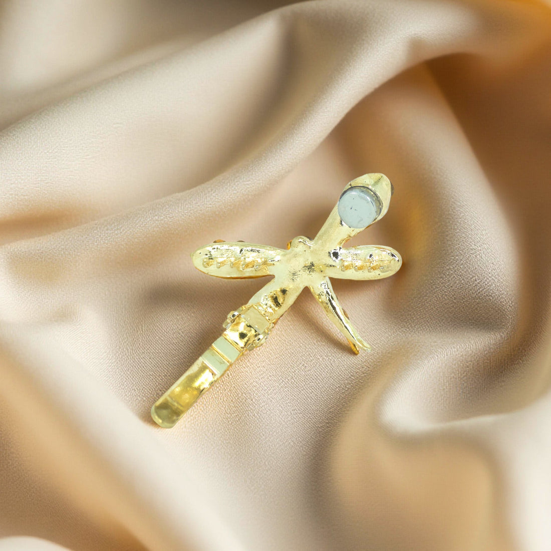 Back view of Haerime Aeris Wing Clip – hidden magnetic clasp design in amber