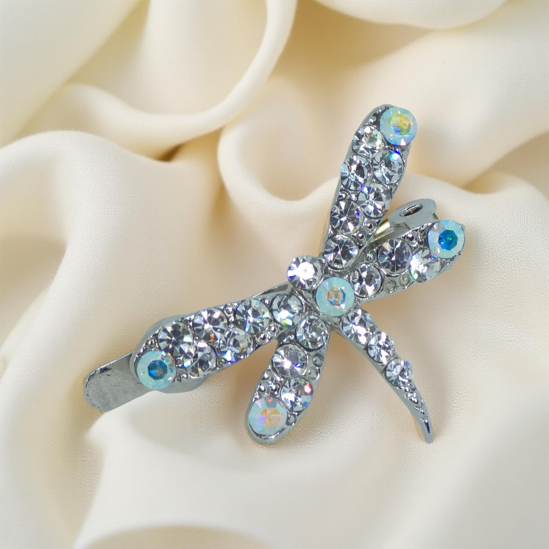 Close-up of hand-set clear rhinestones on Haerime Aeris Wing Clip with dragonfly wings