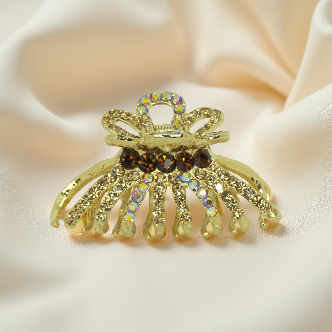 Amber crystal detailing on Haerime Aurefan Arc Claw – warm-toned glamour finish
