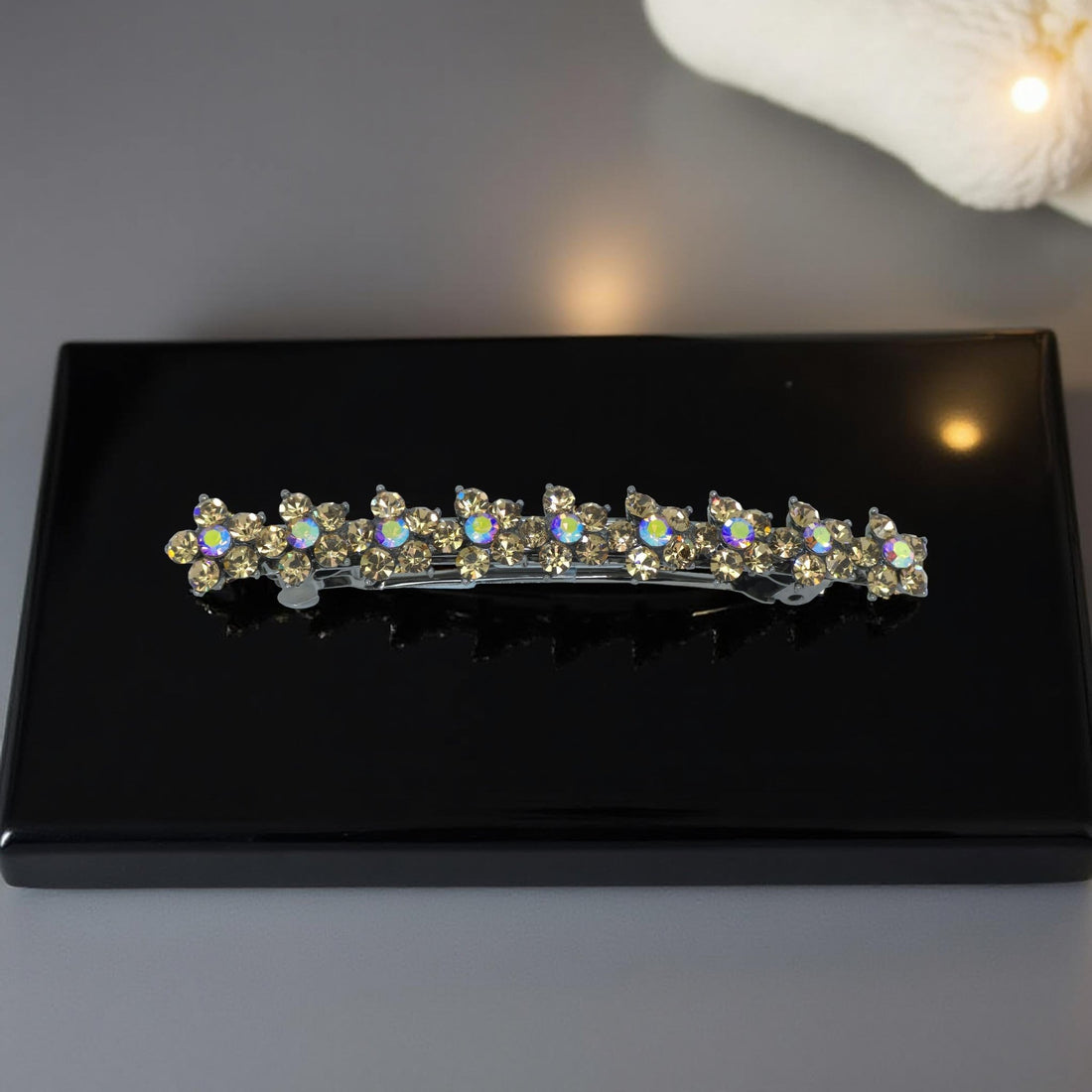 Haerime Aureflor Arc Barrette in Amber close-up – golden rhinestones in floral arc pattern on burnished base