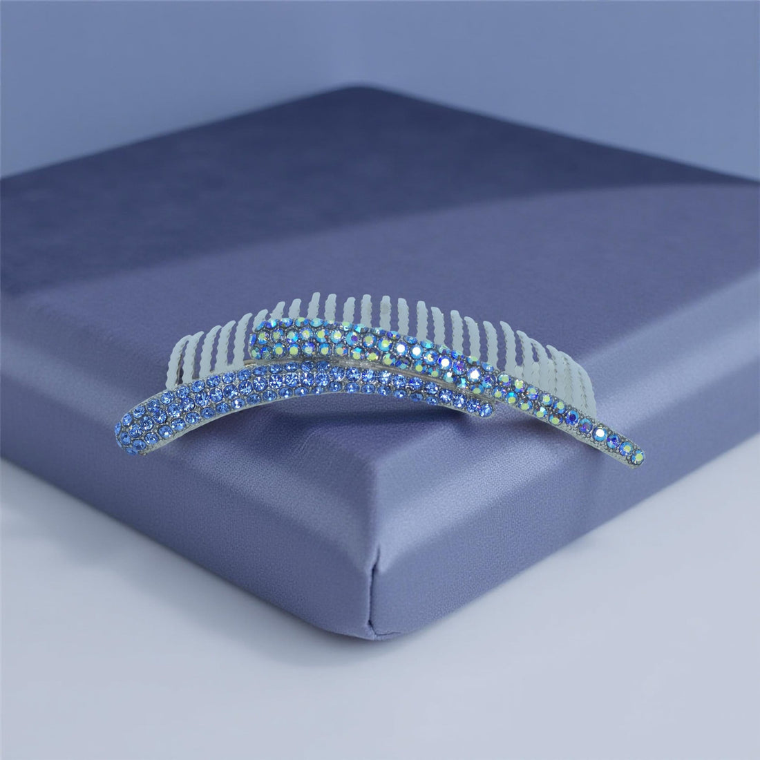 Haerime Aurelya Dual Arc Comb in Blue showing curved pavé design and dual arc silhouette