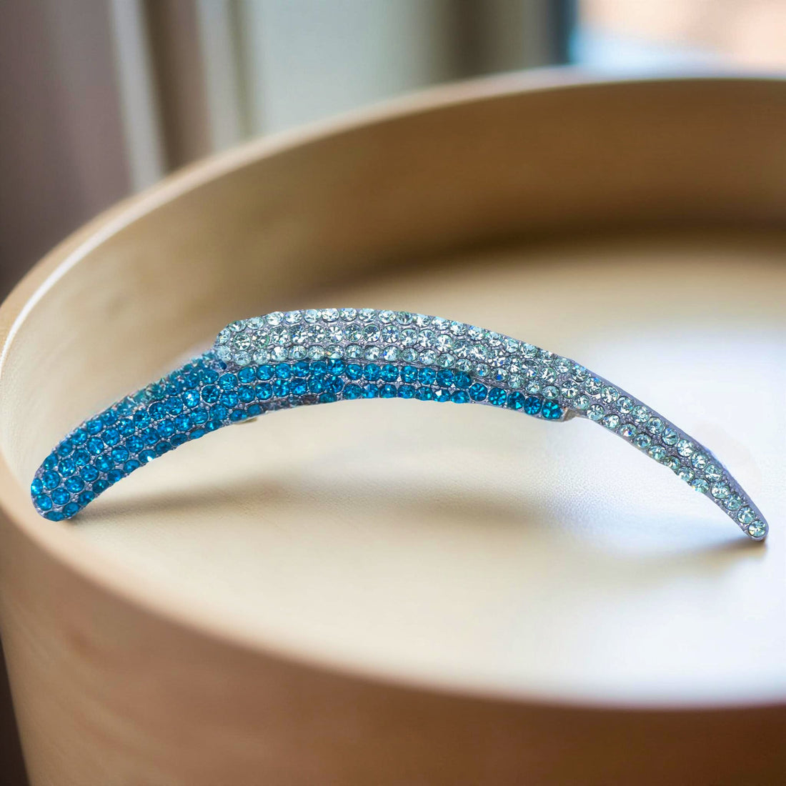 Haerime Aurelya Dual Arc Comb in Blue Zircon showing curved pavé design and dual arc silhouette