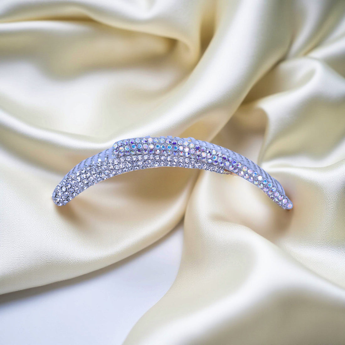 Haerime Aurelya Dual Arc Comb in Clear showing curved pavé design and dual arc silhouette