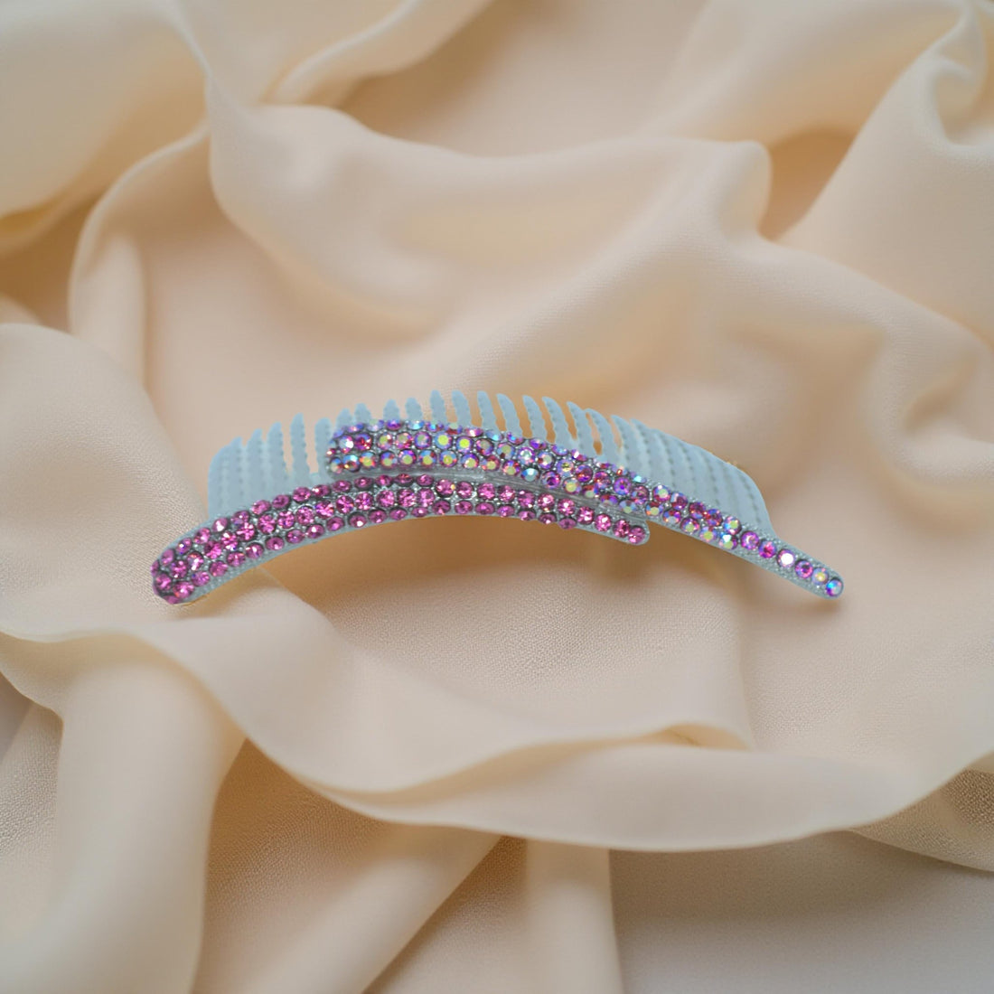 : Haerime Aurelya Dual Arc Comb in Fuschia showing curved pavé design and dual arc silhouette