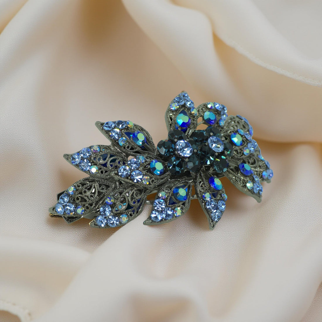 Haerime Aurora Filigree Barrette in Blue showing antique lace petal detail and clustered Austrian crystals