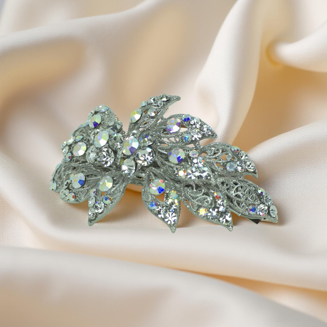 Side view of Haerime Aurora Filigree Barrette in Clear – curved floral shape and openwork metal design