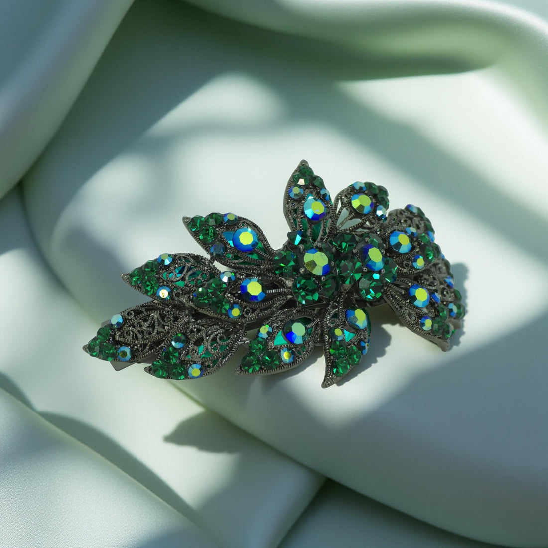 : Haerime Aurora Filigree Barrette in Green showing antique lace petal detail and clustered Austrian crystals