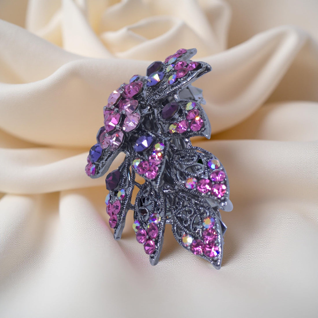 Side view of Haerime Aurora Filigree Barrette in Pink – curved floral shape and openwork metal design