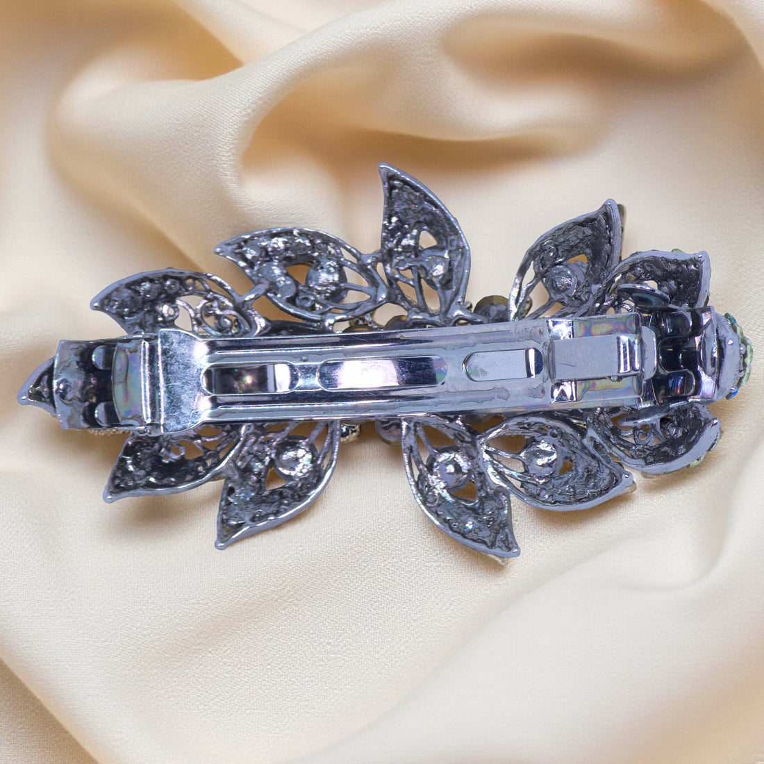 Back side of Haerime Aurora Filigree Barrette in Red – French clasp and layered crystal construction