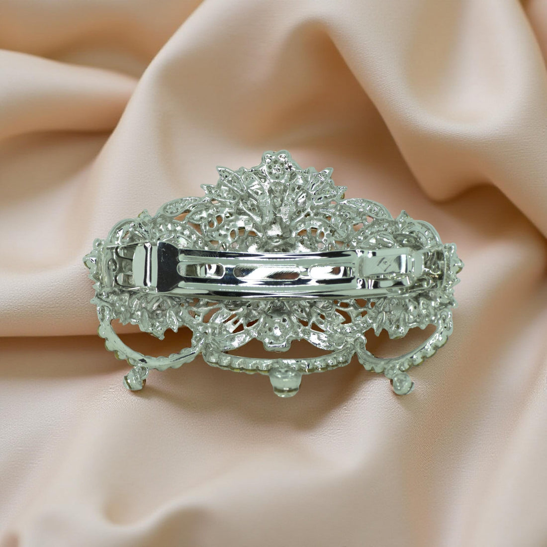 Back view of Haerime Celestara Bloom Clip in Clear – claw spring and open golden filigree design