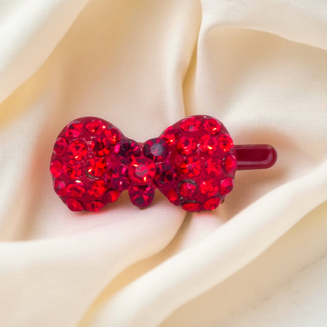 Red version of Haerime Chérie Clip – magnetic mini bow hair clip with crystal detailing