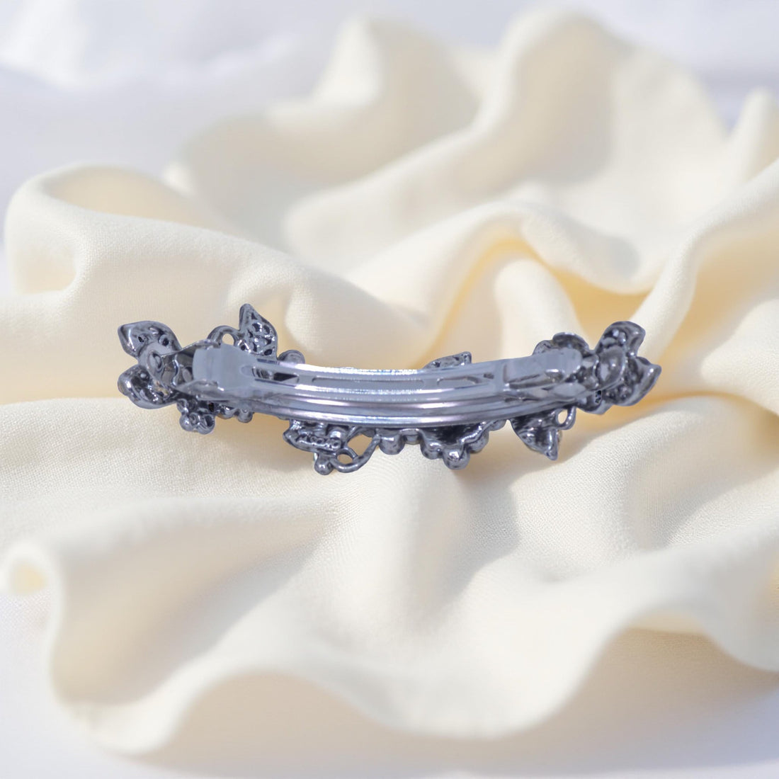 Back view of Haerime Elysia Garland Barrette in Blue – secure alligator clasp with vintage finished underframe