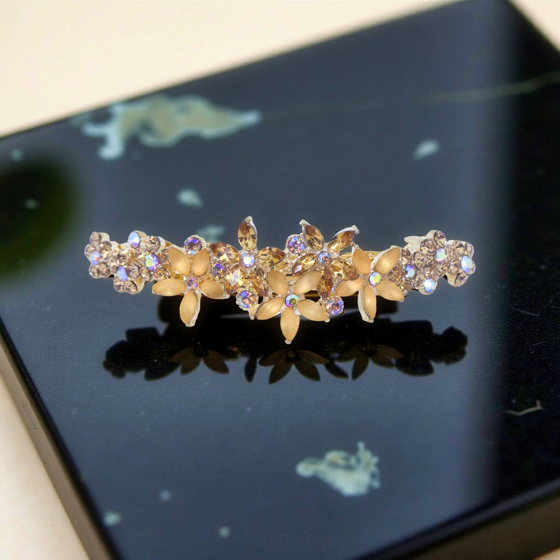 Amber version of Haerime FleurVerre Cascade – warm golden floral design with marquise crystal blossoms