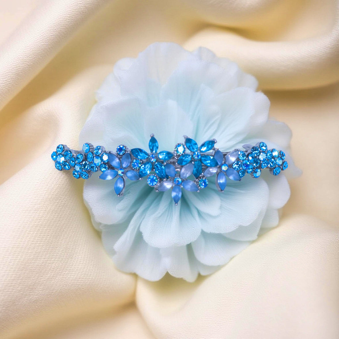 Haerime FleurVerre Cascade Barrette in Aquamarine close-up – pastel-blue blossoms with layered crystal sparkle