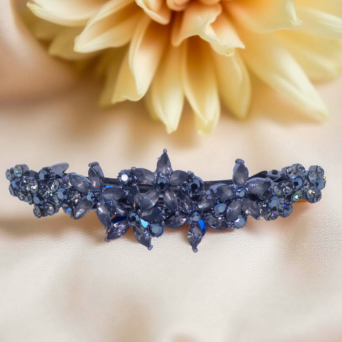Haerime FleurVerre Cascade Barrette in Black close-up – dark crystal petals with silver leaf filigree on matte background