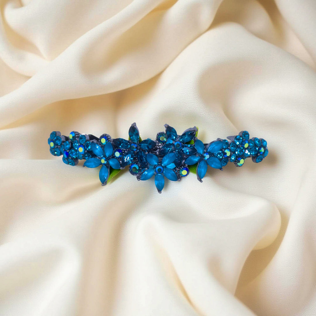 Haerime FleurVerre Cascade Barrette in Blue Zircon close-up – hand-set clustered petals, oxidized silver leaf base, and layered sparkle