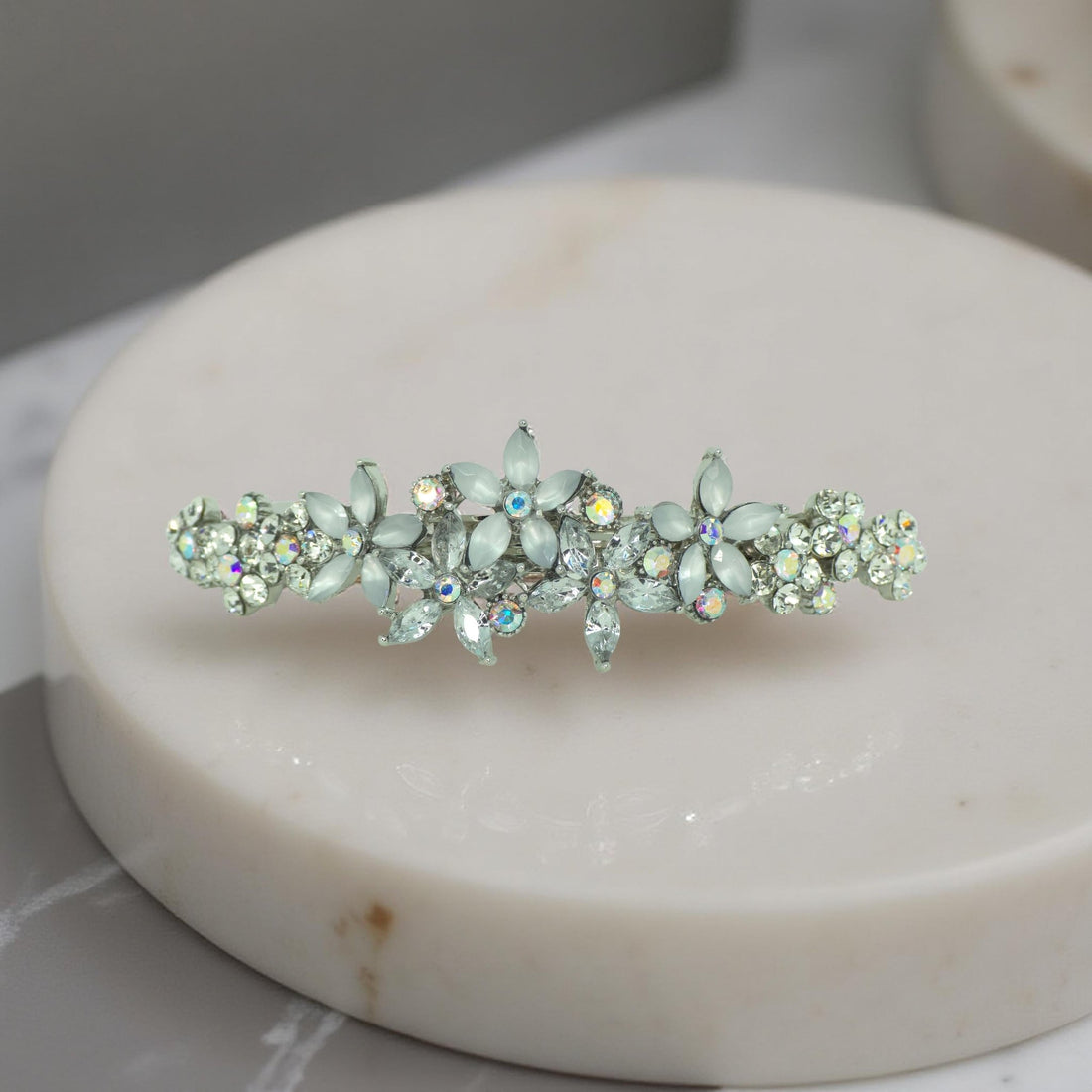 Haerime FleurVerre Cascade Barrette in Clear close-up – shimmering clustered crystals over antique silver curve