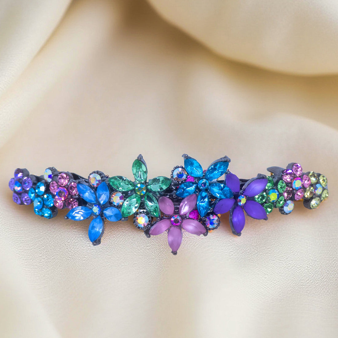 Haerime FleurVerre Cascade Barrette in Rainbow close-up – hand-set clustered petals, oxidized silver leaf base, and layered sparkle