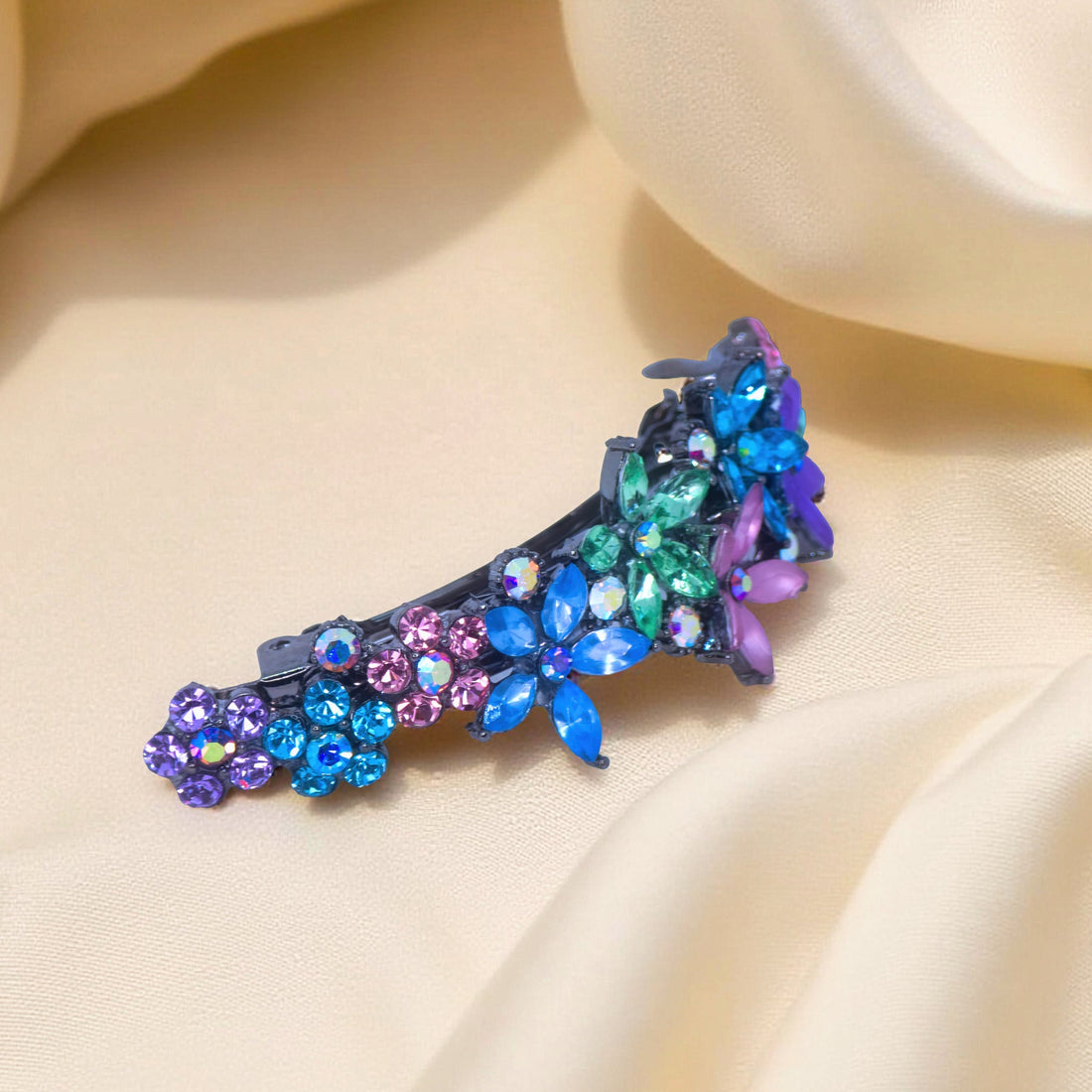 : Side view of Haerime FleurVerre Cascade Barrette in Rainbow – arched silhouette with floral structure and antique silver stem