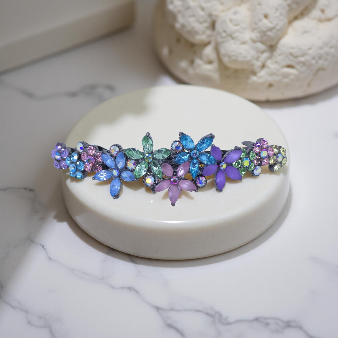 Rainbow version of Haerime FleurVerre Cascade – curved wildflower barrette with marquise crystal blossoms