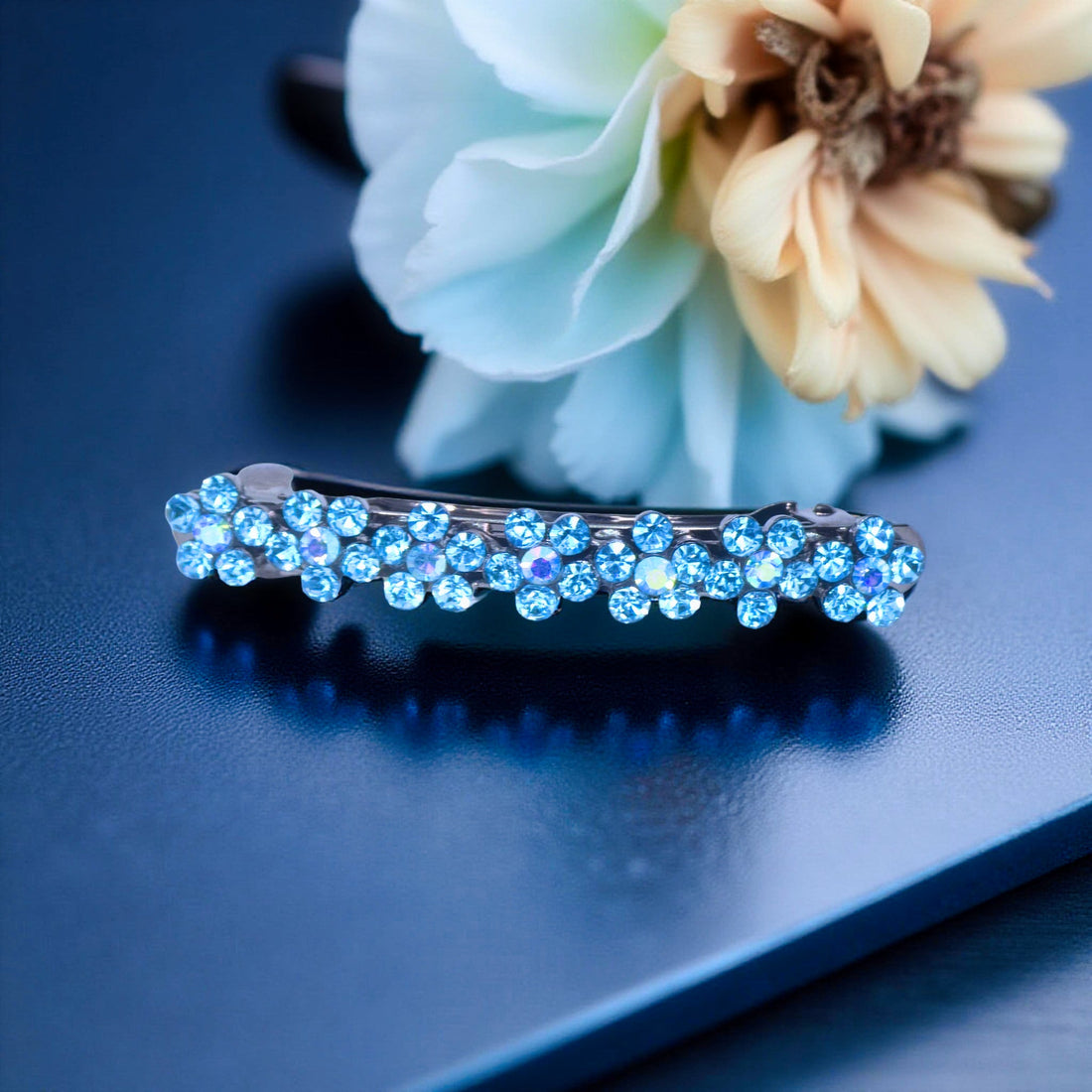 Aquamarine version of Haerime FloraDot Row – pastel crystal barrette with curved silver leaf finish