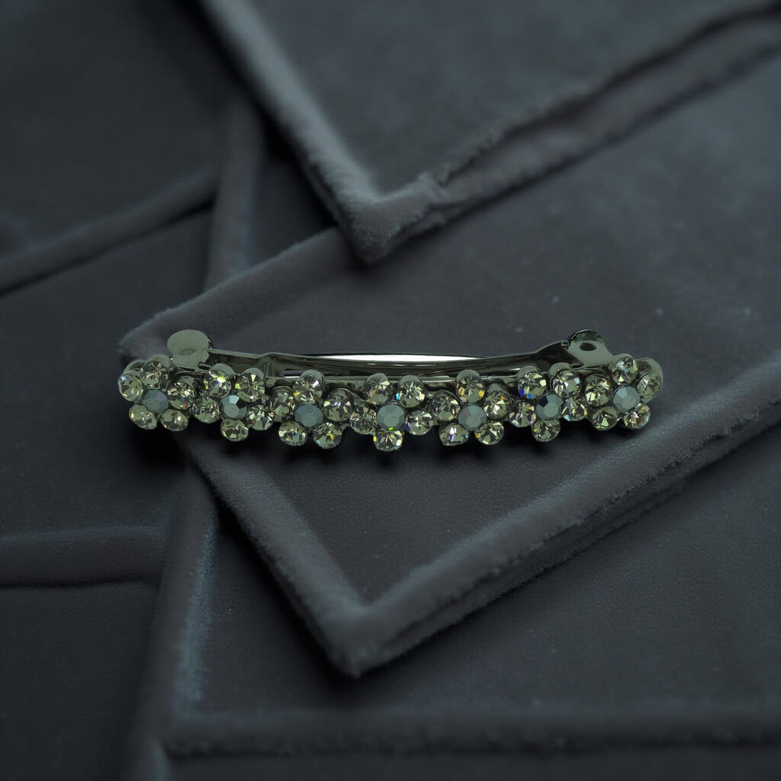 Haerime FloraDot Row Barrette in Black close-up – glossy floral texture with layered depth