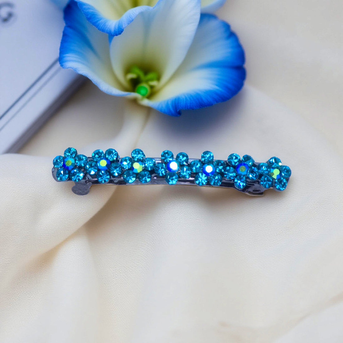 Blue Zircon version of Haerime FloraDot Row – icy teal floral mini clip with shimmering arch design