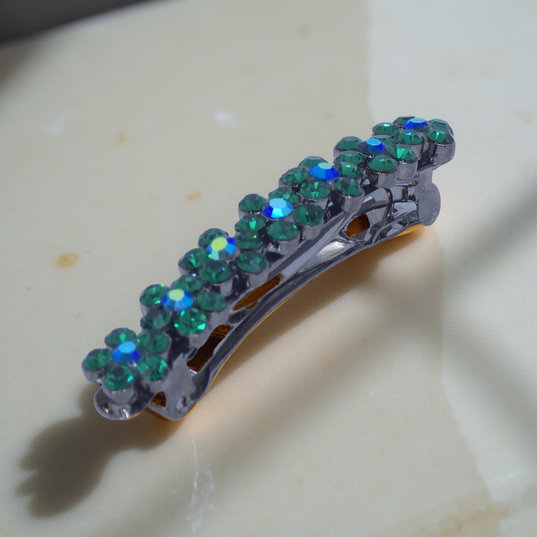 Haerime FloraDot Row Barrette in Green macro shot – clustered rhinestones and floral arc shine