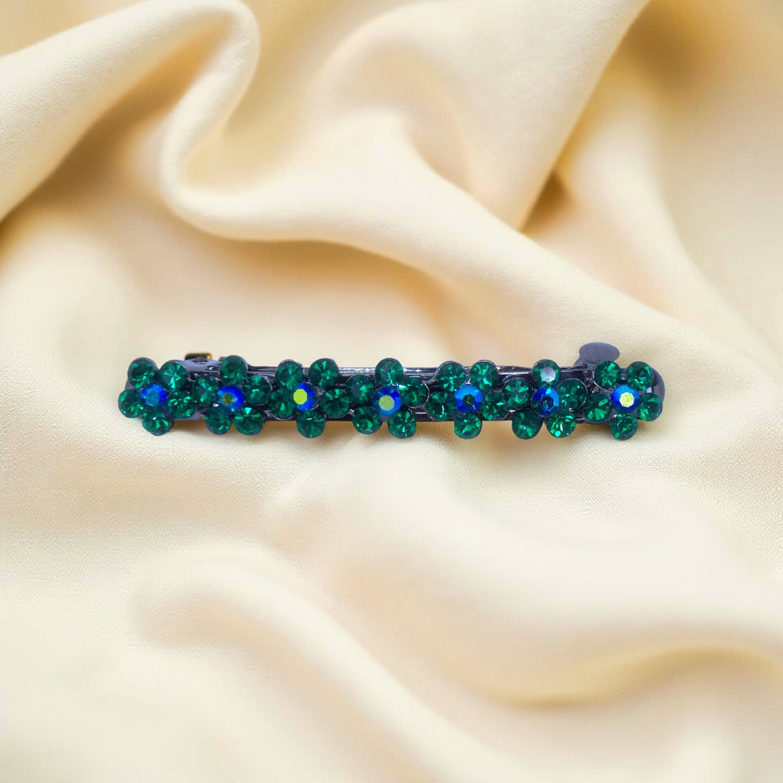 Green version of Haerime FloraDot Row – mini curved floral barrette with leaf-inspired crystal sparkle