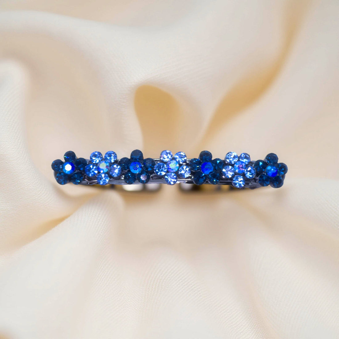 Multi Blue version of Haerime FloraDot Row – vibrant crystal gradient mini barrette in sapphire to sky tones