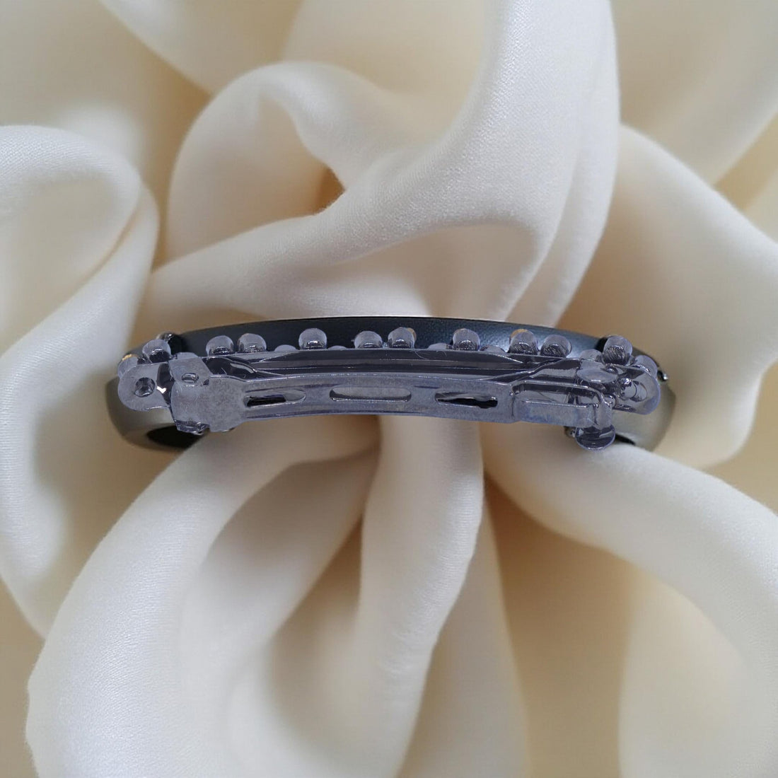 Back view of Haerime FloraDot Row Barrette in Purple – spring-loaded clasp with dark silver underframe and curve