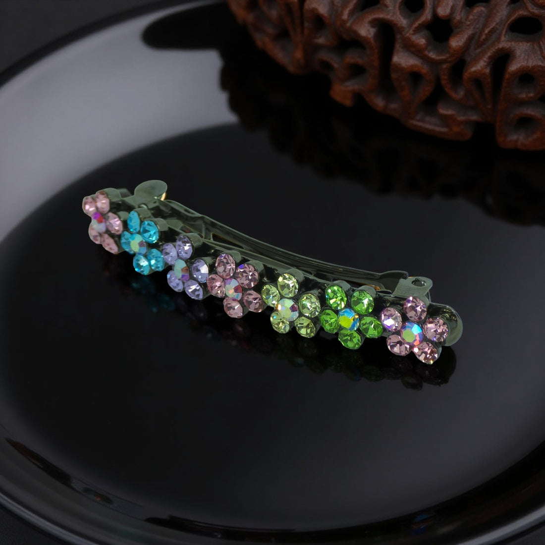 : Haerime FloraDot Row Barrette in Rainbow angled view – showing profile height and layered crystal reflection