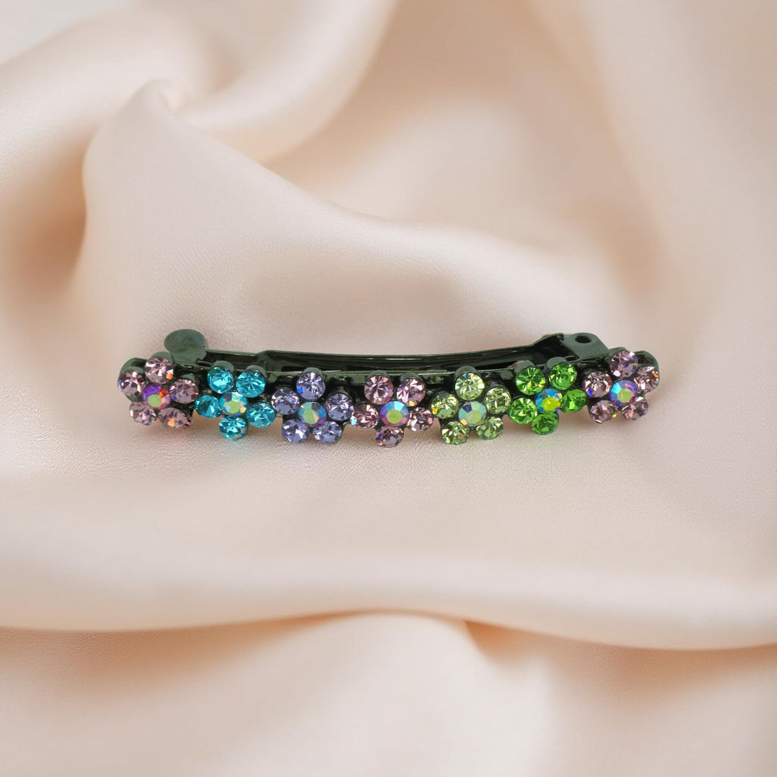 Rainbow version of Haerime FloraDot Row – curved mini barrette with crystal flower row