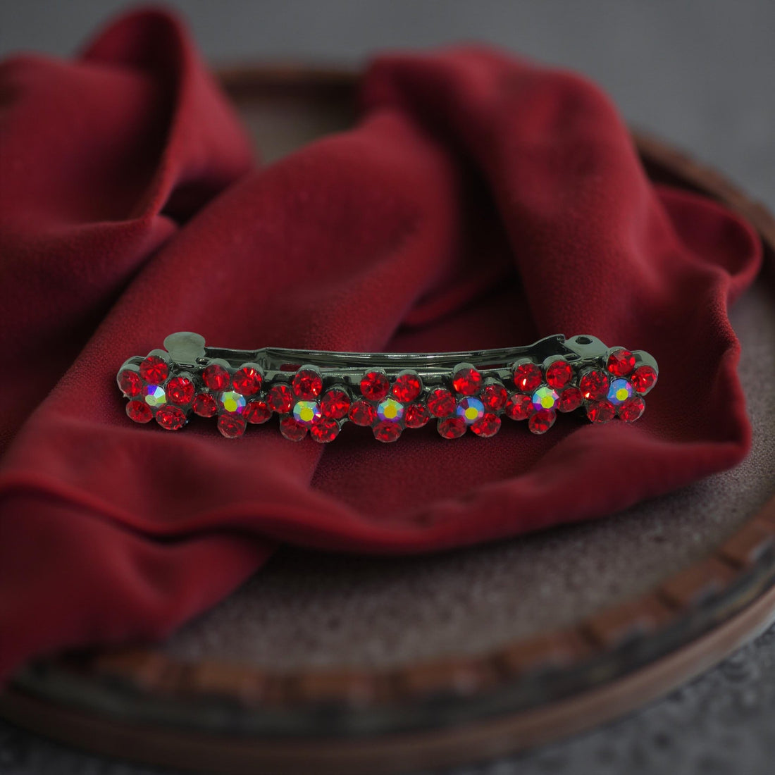 Haerime FloraDot Row Barrette in Red close-up – fire-red rhinestones arranged in floral arcs