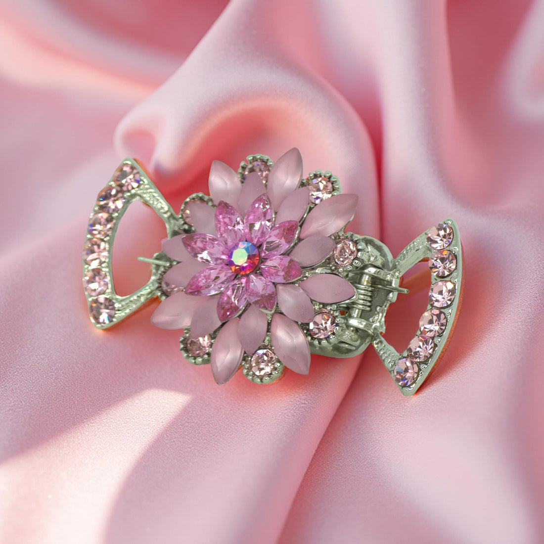 Pink version of Haerime Floréa Blossom Claw – sculpted floral jaw clip with crystal-framed wings