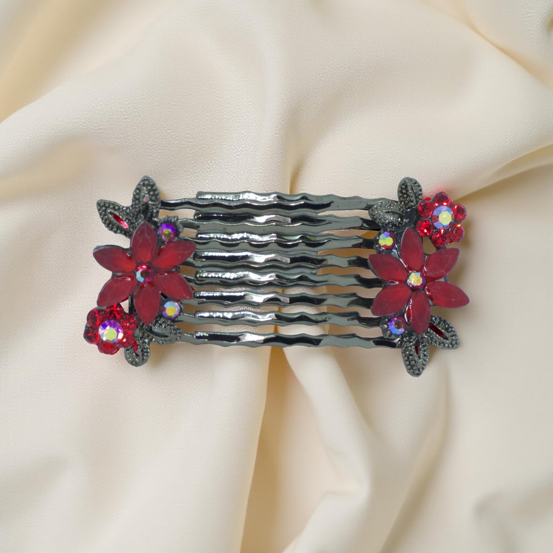 : Haerime Florelle Petite Pair Combs in Red close-up – faceted floral pair with layered gems on metal prongs