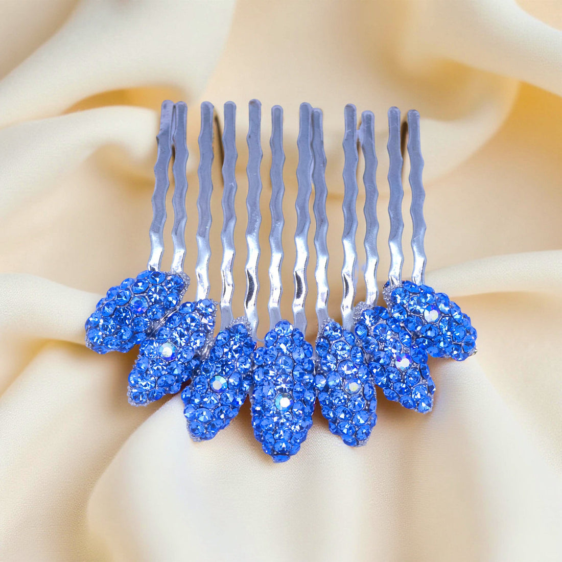 Blue version of Haerime Gleamleaf Crown Comb – sapphire crystal leaves with curved silver comb teeth
