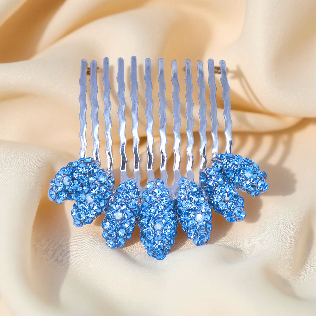 Blue Zircon version of Haerime Gleamleaf Crown Comb – bold teal leaf crystals on metal arc comb