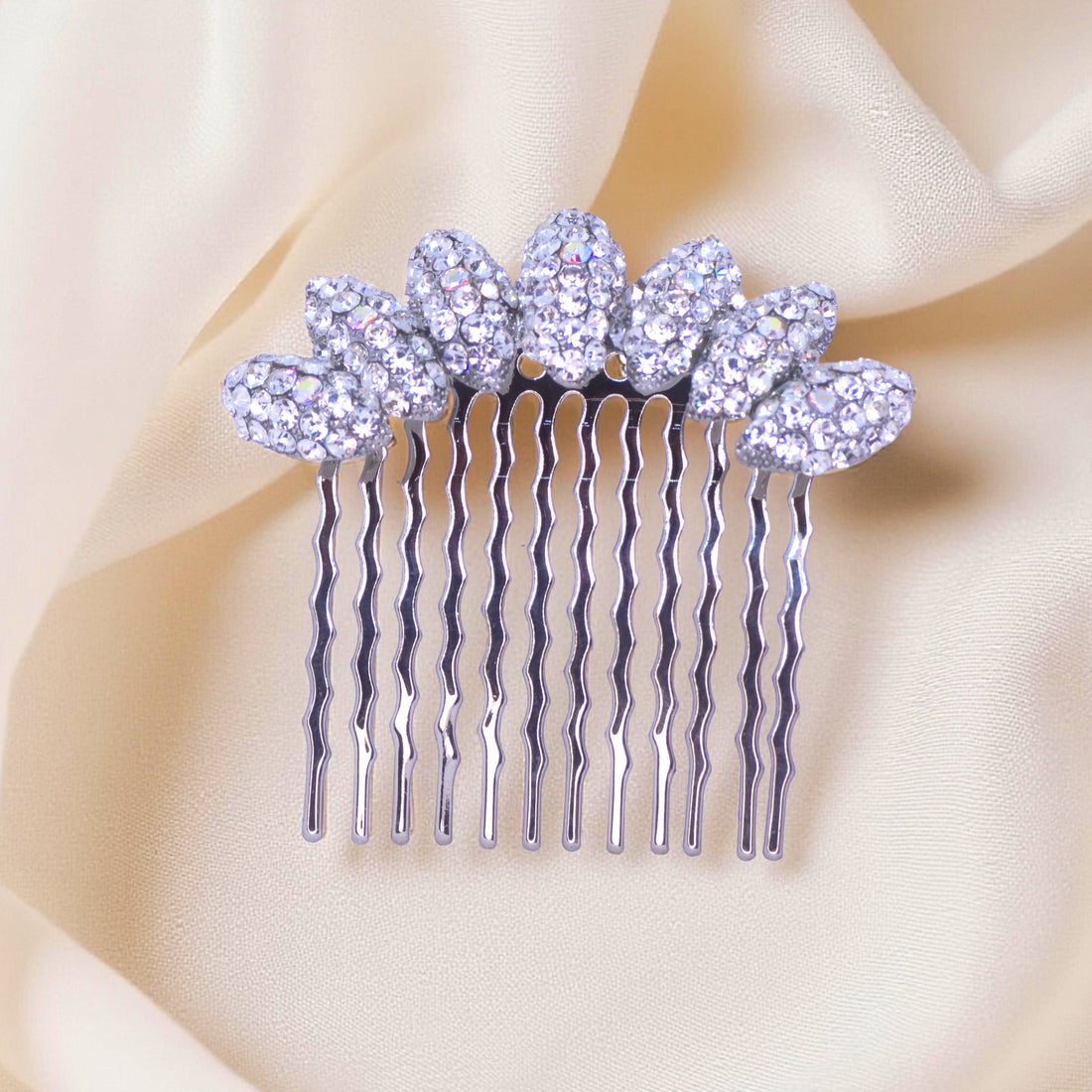 Haerime Gleamleaf Crown Comb in Clear – close-up showing high-luster transparent leaves on gold-tone base