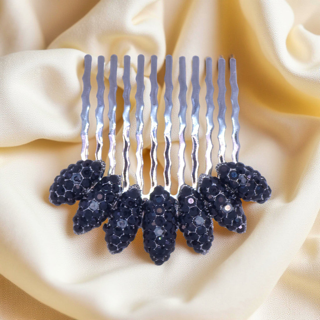 Jet Black version of Haerime Gleamleaf Crown Comb – deep black leaf crystals styled in moon arc form