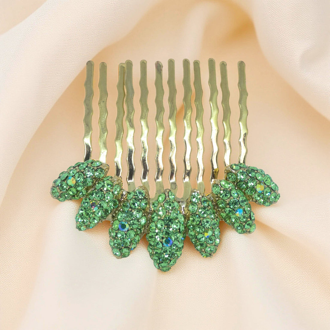 Peridot version of Haerime Gleamleaf Crown Comb – soft green faceted crystals arranged in a crescent botanical form