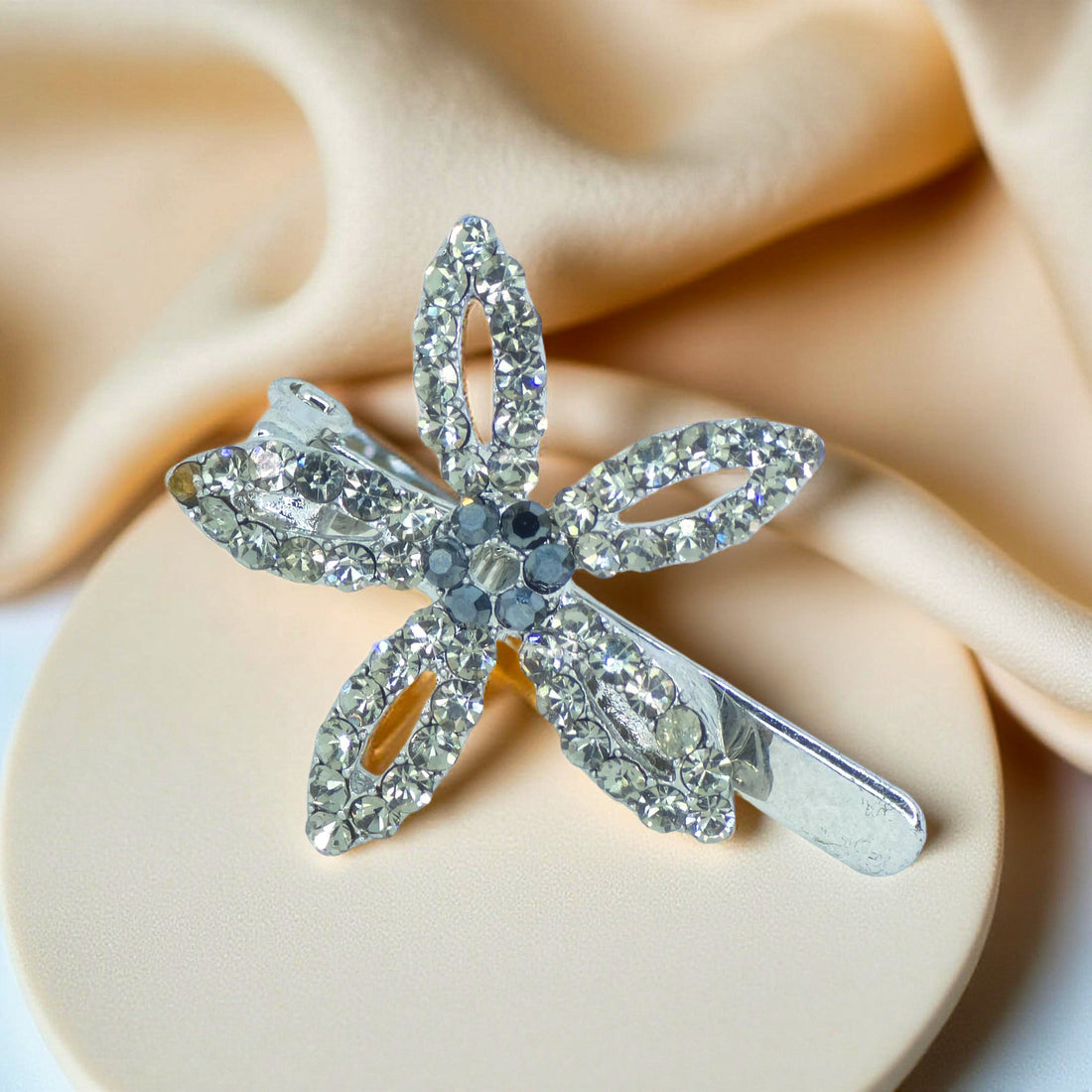 Haerime LilyGleam Clip in Black – sleek jet-black floral clip in front view with crystal pavé petals