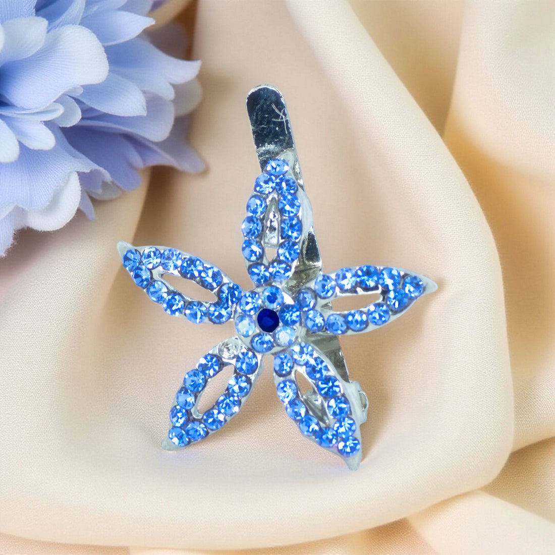 Haerime LilyGleam Clip in Blue – sapphire-toned crystal petals forming elegant floral silhouette on silver-tone base