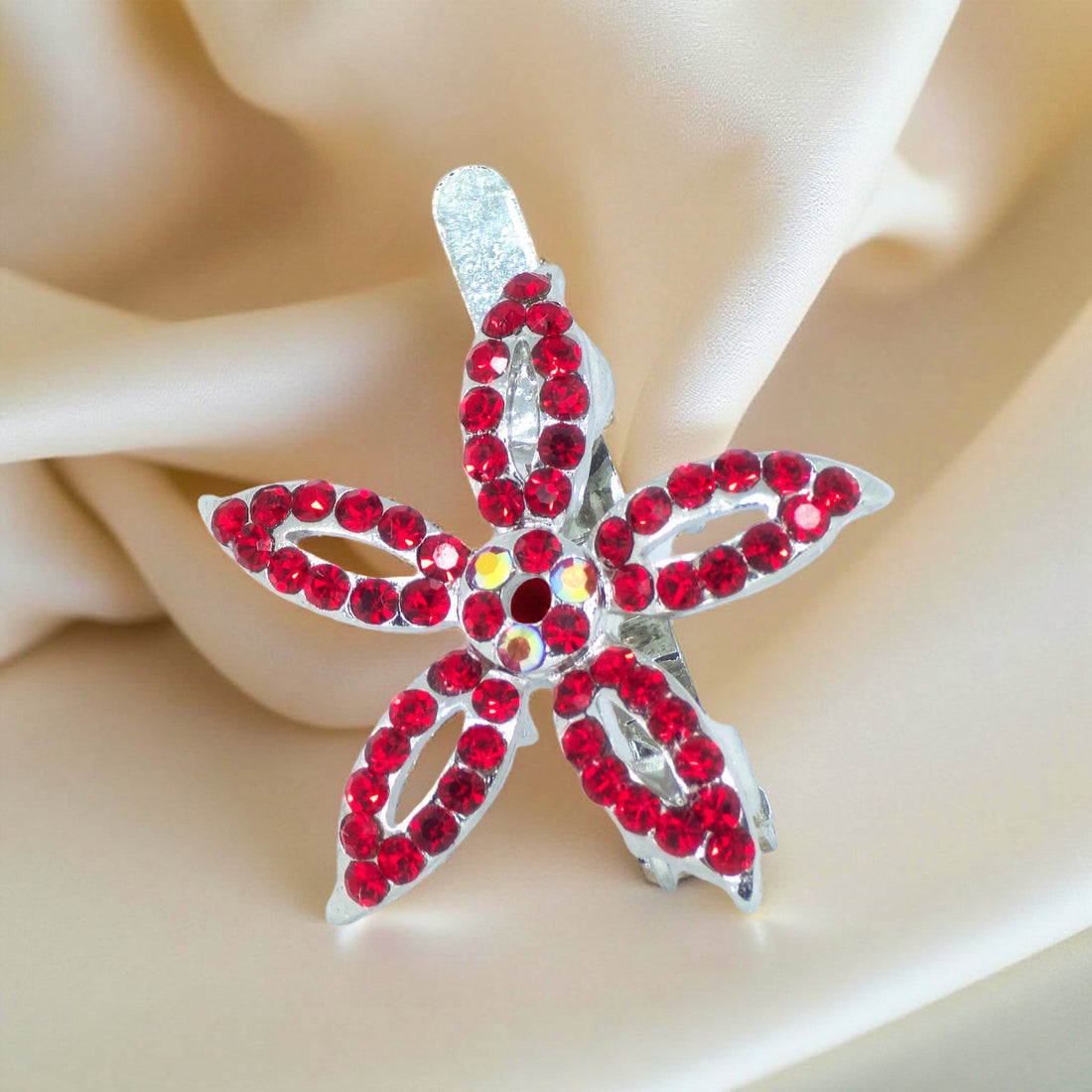 Haerime LilyGleam Clip in Red – zoomed-in view of red crystal petals and metallic finish on neutral background