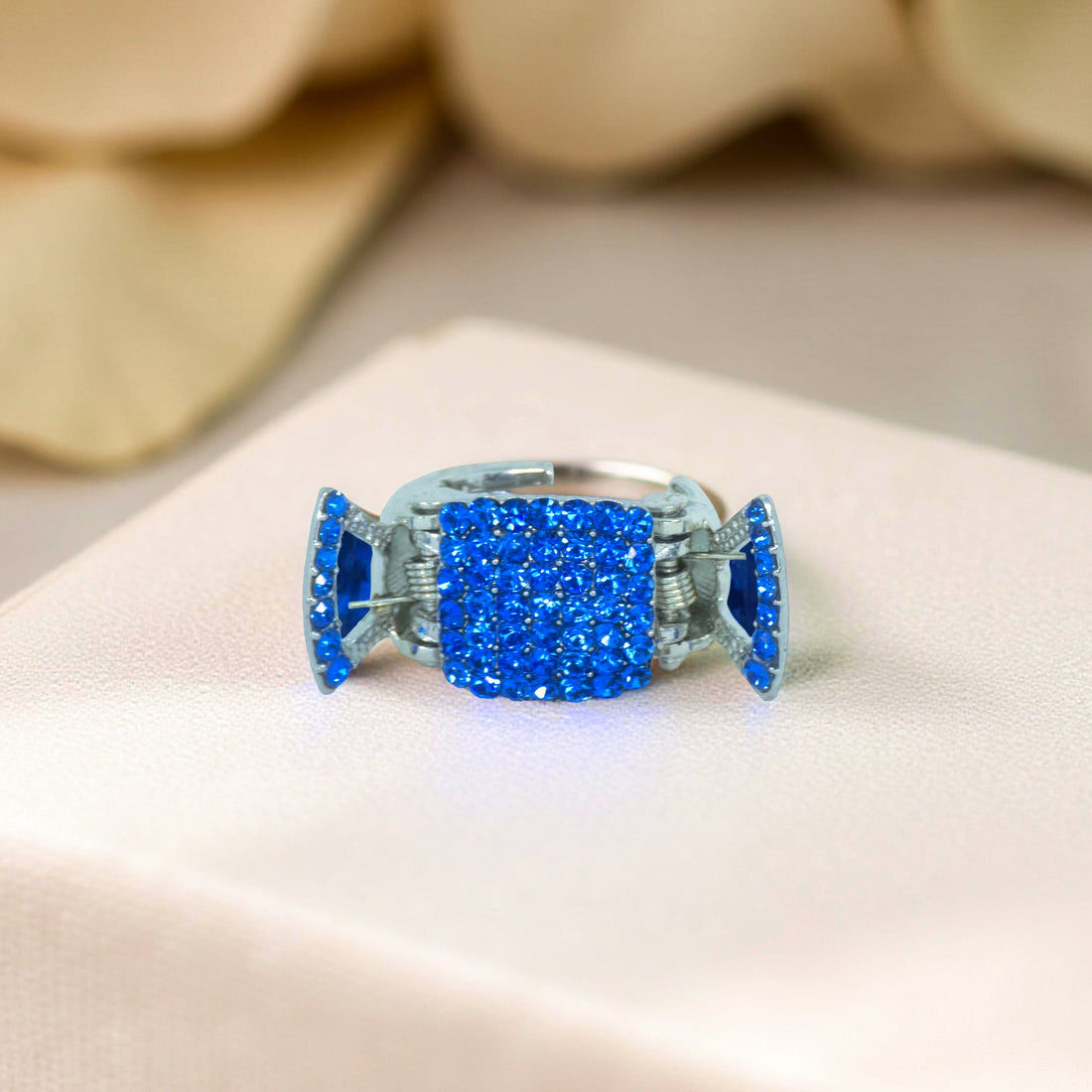 Haerime LumiClasp Mini in Blue – close-up of sapphire pavé arc reflecting bold tone, perfect for daily chic styling