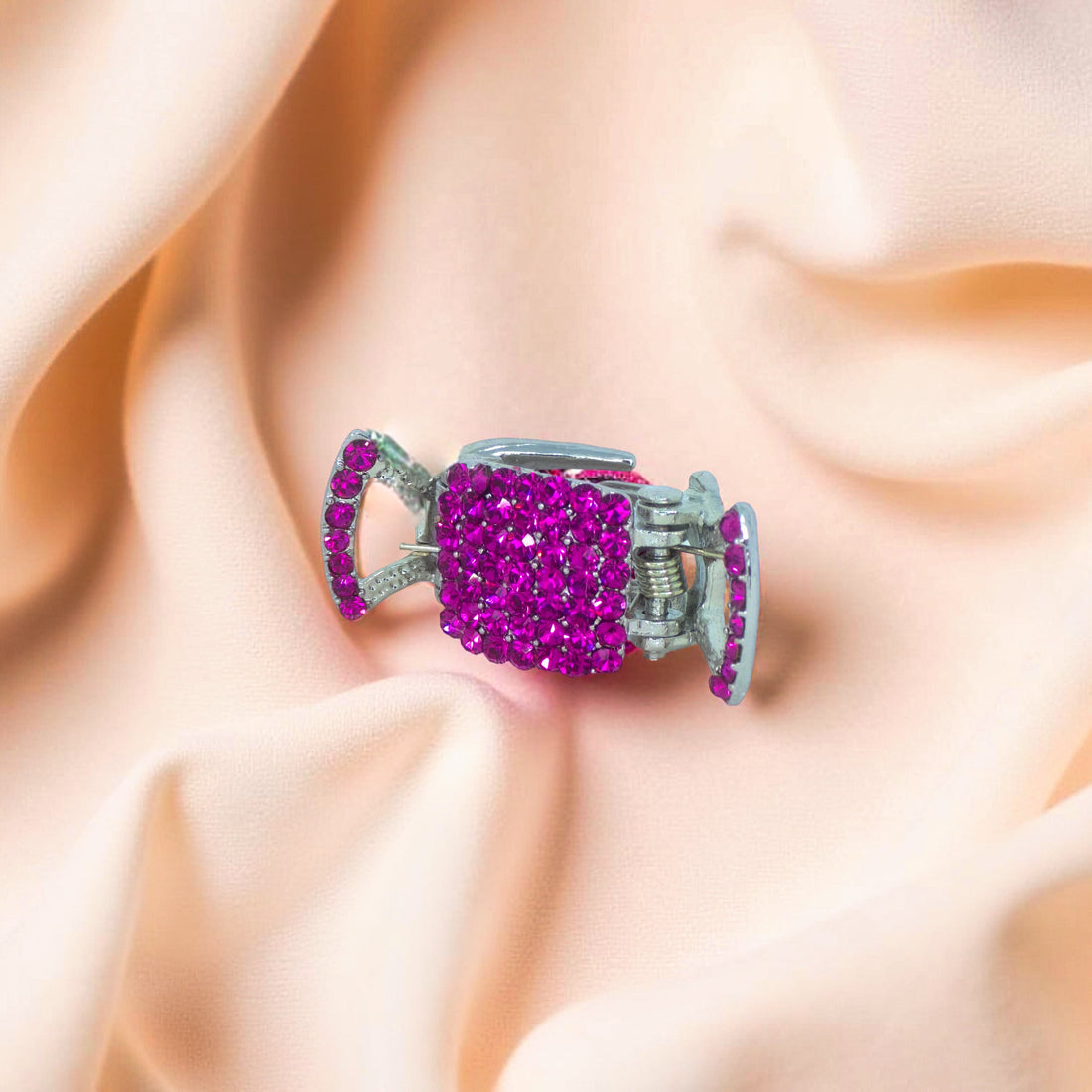 : Haerime LumiClasp Mini in Fuchsia – close-up capturing radiant pavé crystals and strong mini claw grip