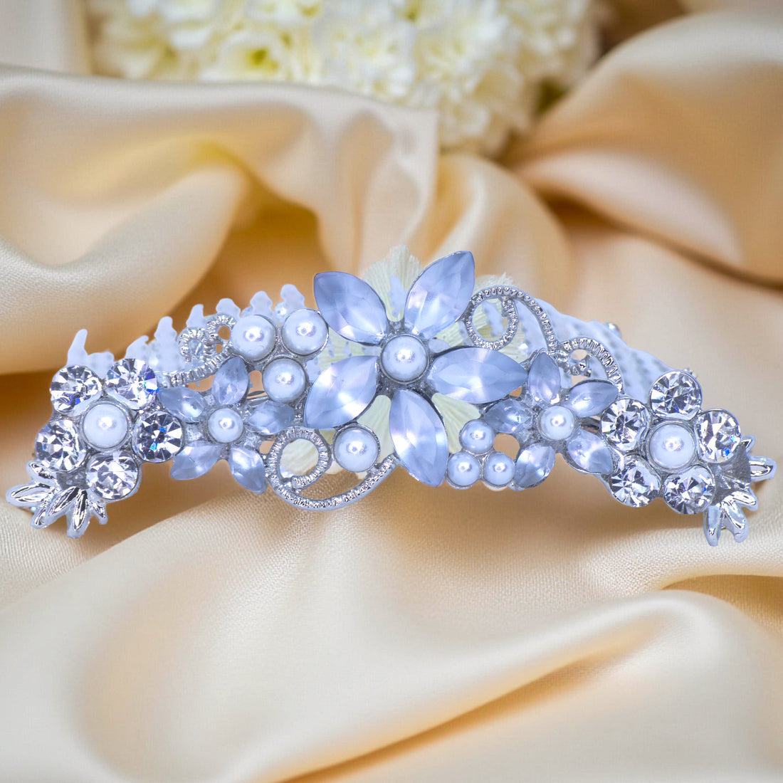 Haerime Lunaria Vine Comb in Pearl – top view of luminous pearl floral comb on soft gold satin
