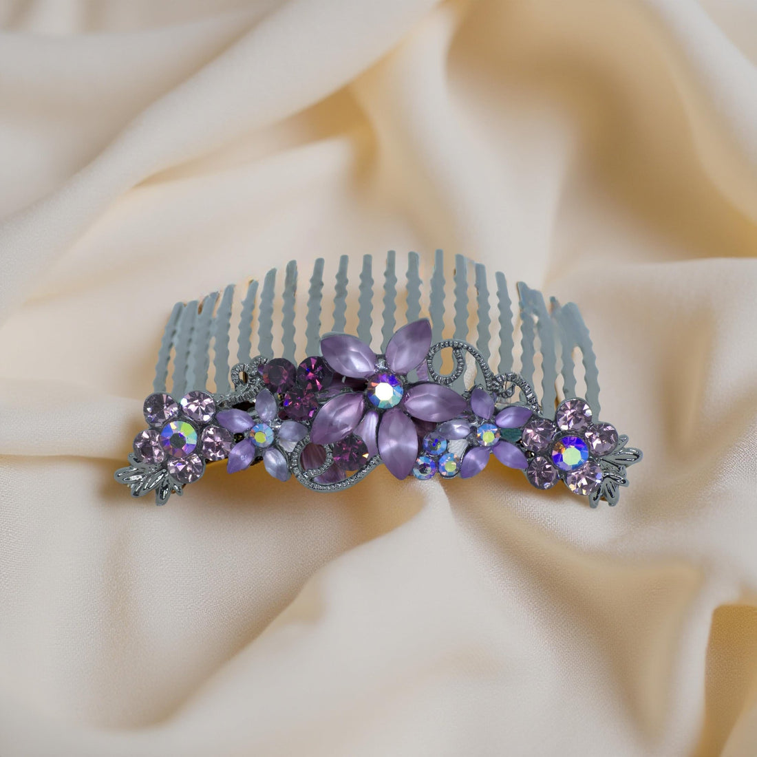 Haerime Lunaria Vine Comb in Purple – top view of lavender floral comb on cream velvet pouch