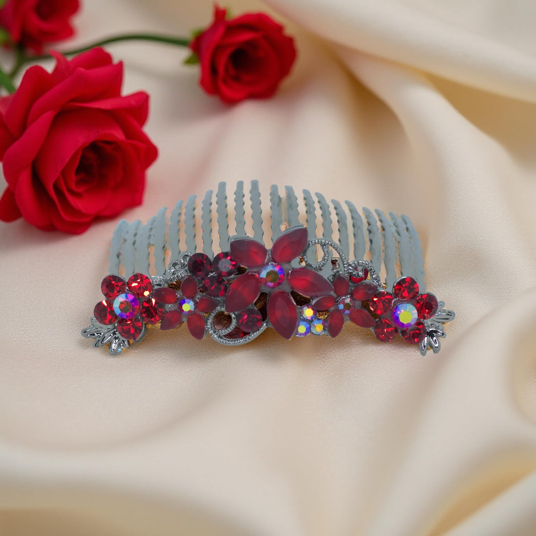 Haerime Lunaria Vine Comb in Red – top view of ruby red crystal floral comb glowing against cream background